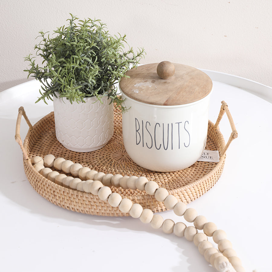 Ceramic biscuit jar with wooden lid,
Farmhouse biscuit canister, Rustic kitchen storage jar, Handwoven rattan tray, Round wicker serving tray, Boho rattan tray with handles, Rustic decorative tray.