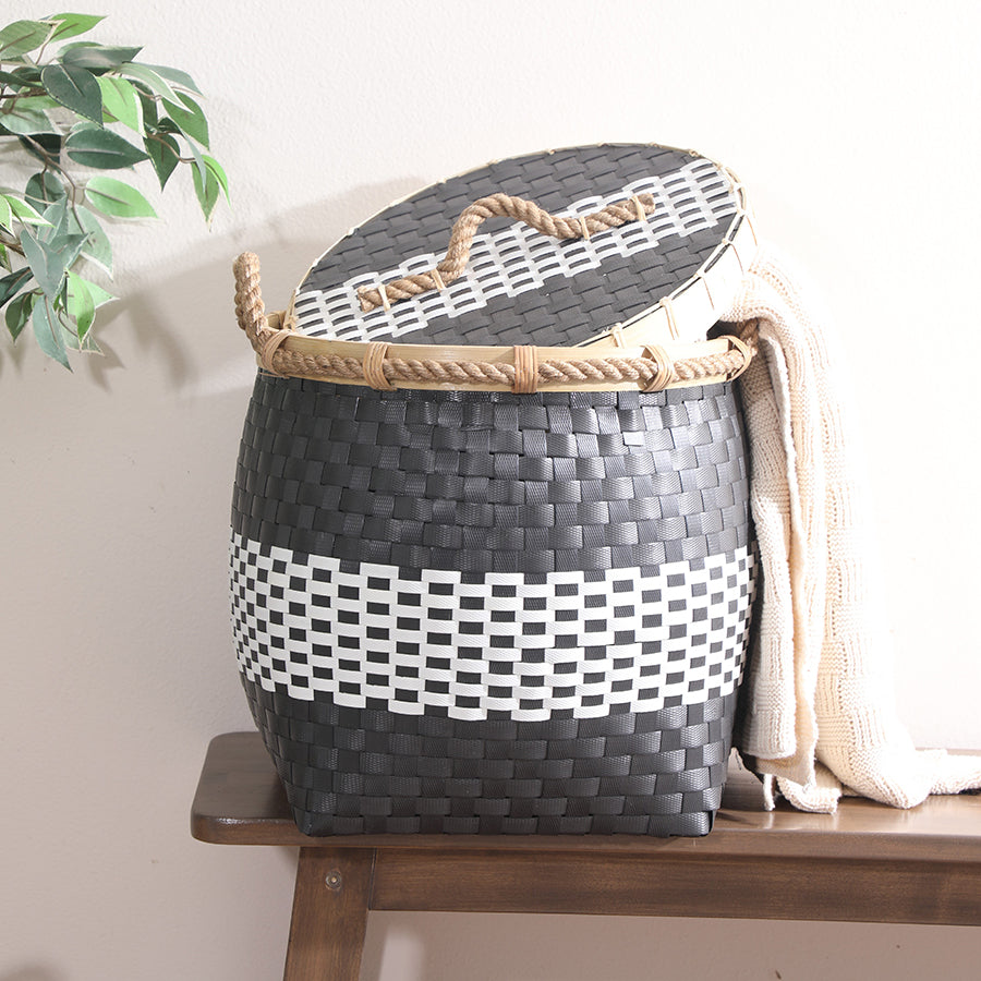 Woven laundry basket, Black and white storage basket, Decorative laundry hamper, Plastic woven hamper, Handwoven storage basket,
Basket with lid and handle, Modern laundry basket, Eco-friendly storage basket, Large clothes hamper,
Indoor home organizer basket.