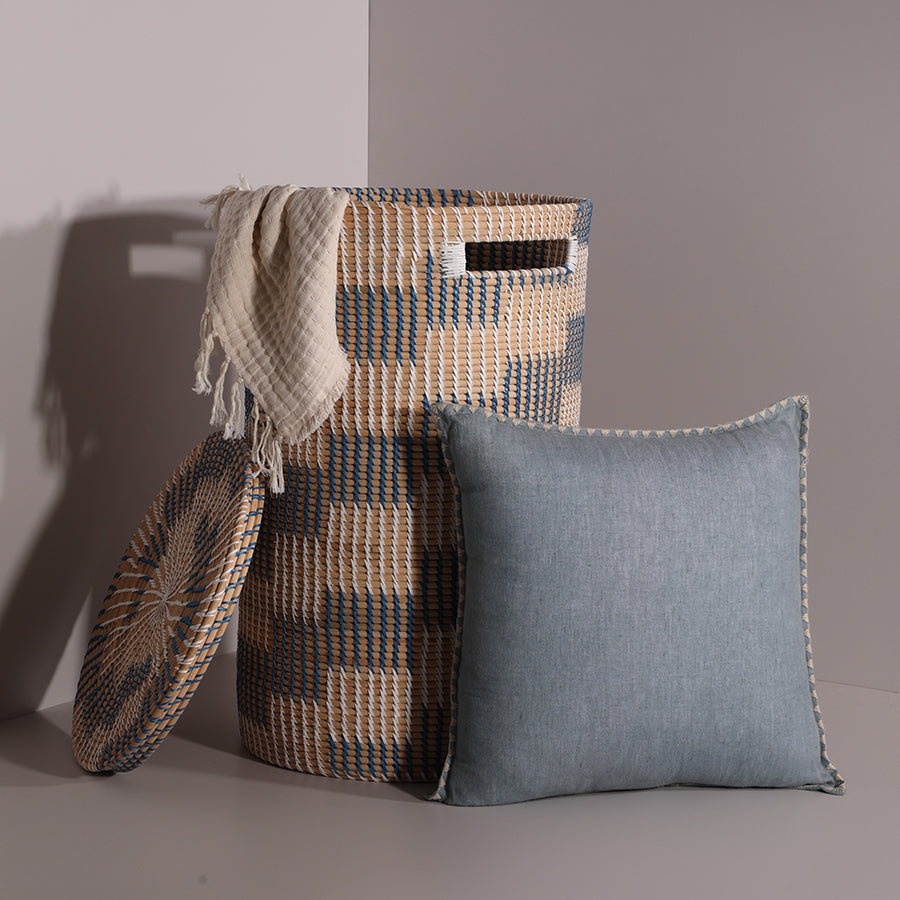 Decorative woven basket with lid, Handwoven lidded storage basket, 
Blue and beige checkered basket, 
Tall seagrass laundry basket, Cream cotton throw blanket, Waffle weave fringed blanket, Lightweight neutral throw, Soft decorative sofa throw, Blue decorative throw pillow, Linen look cushion with trim, Soft square accent pillow, Modern minimalist sofa cushion, Neutral blue pillow for couch.