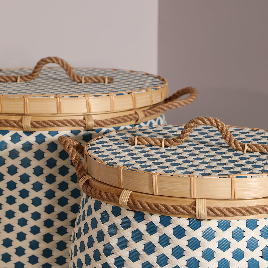 Lidded woven storage basket,
Blue and white handwoven basket,
Decorative bamboo basket with rope handles, Eco-friendly handcrafted basket, Round top storage basket with lid, Natural woven organizer bin,
Handmade rope handle basket, Stylish woven laundry hamper.