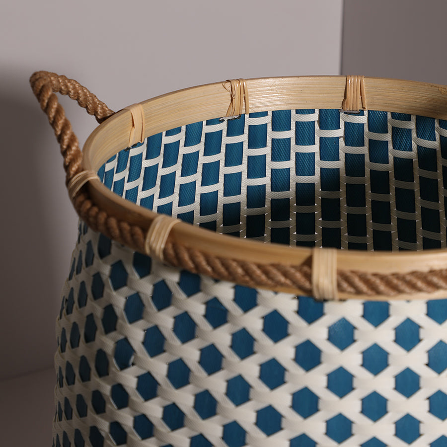 Open-top woven storage basket,
Handcrafted blue and white basket, Eco-friendly laundry basket, Bamboo rim woven basket, Rope handle organizer basket, Handmade home storage bin, Decorative basket with diamond pattern, Woven plastic and natural fiber basket, Artisan basket for laundry or toys, Modern Boho style storage basket, Blue and ivory storage bin, Hand-braided storage solution.