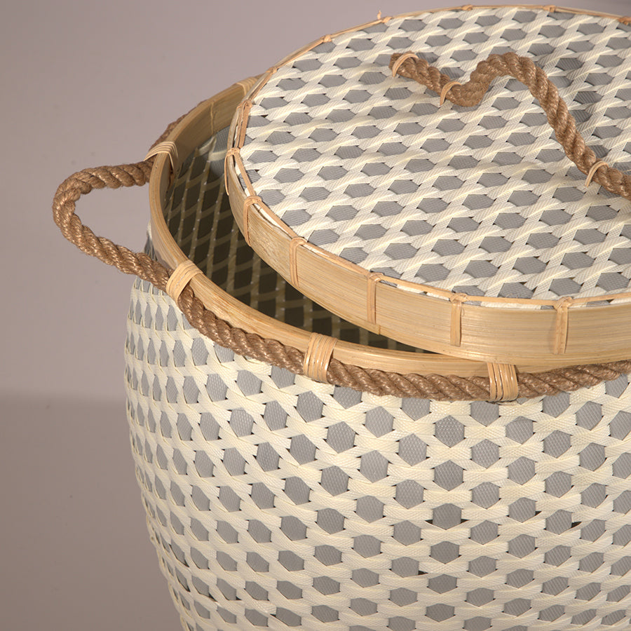 Woven storage basket with lid, Rope handle laundry basket, Bamboo rim woven hamper, Decorative wicker-style basket, Handcrafted lidded storage basket, Rustic woven bin with natural finish, Multi-purpose woven hamper with cover, Artisan-style home storage basket, Durable decorative basket for laundry or toys.