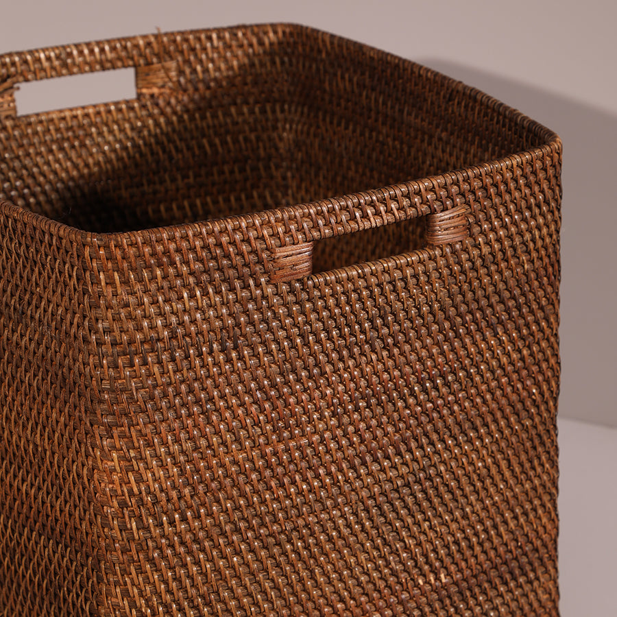 Brown woven storage basket, Handwoven square basket, Rattan-style utility basket, Decorative storage bin with handles, Natural fiber basket for home organization, Rustic woven basket for home décor, Brown hamper basket with built-in handles, Eco-friendly wicker-style storage bin, Handcrafted storage basket for blankets, Multi-purpose woven basket for living room or closet .