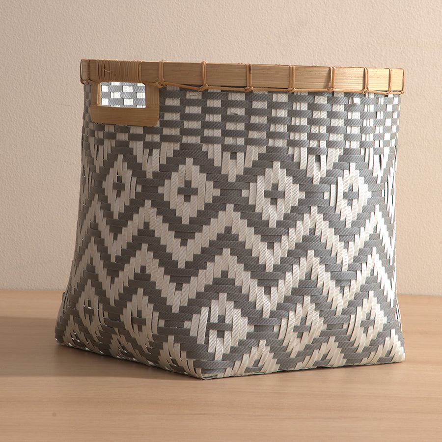 Woven storage basket, Decorative basket with handle, Grey and white basket, Plastic woven bin, Bamboo rim basket, Geometric pattern storage basket, Handwoven indoor basket, Bohemian style basket, Eco-friendly decorative bin,
Storage basket for home décor.