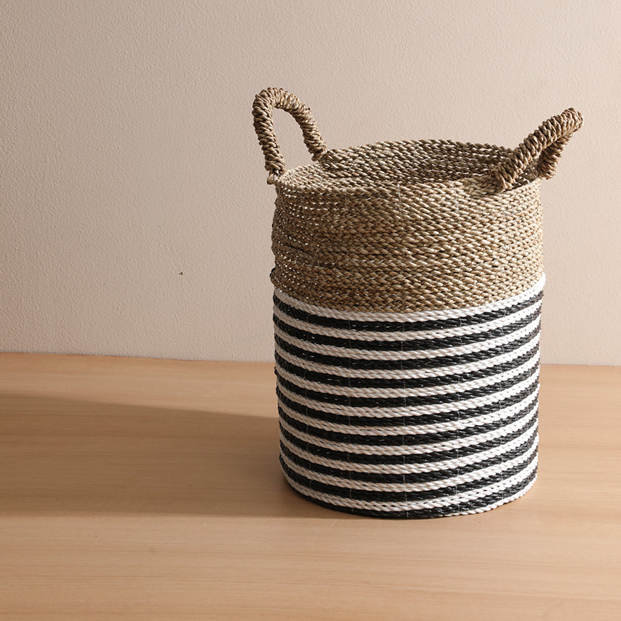 Natural woven laundry basket, Minimalist striped storage basket,
Coastal décor woven basket,
Handmade home organization basket, Decorative storage basket with handles, Eco-conscious woven storage, Black white natural seagrass basket.