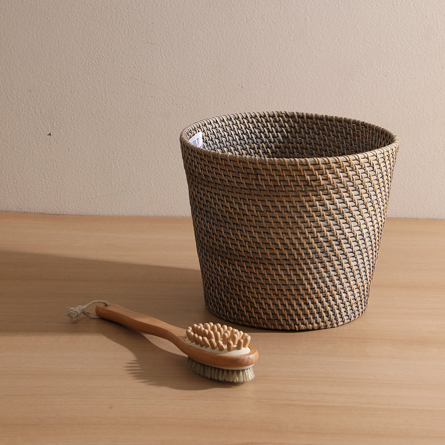 Handwoven rattan basket, Wicker bathroom storage basket, Rustic woven bin with natural brush, Brown rattan laundry hamper, Eco-friendly wicker organizer, Handmade woven storage basket for bathroom, Natural rattan basket with wooden cleaning brush, Rustic home décor basket set, Stylish bin for bathroom or spa storage.