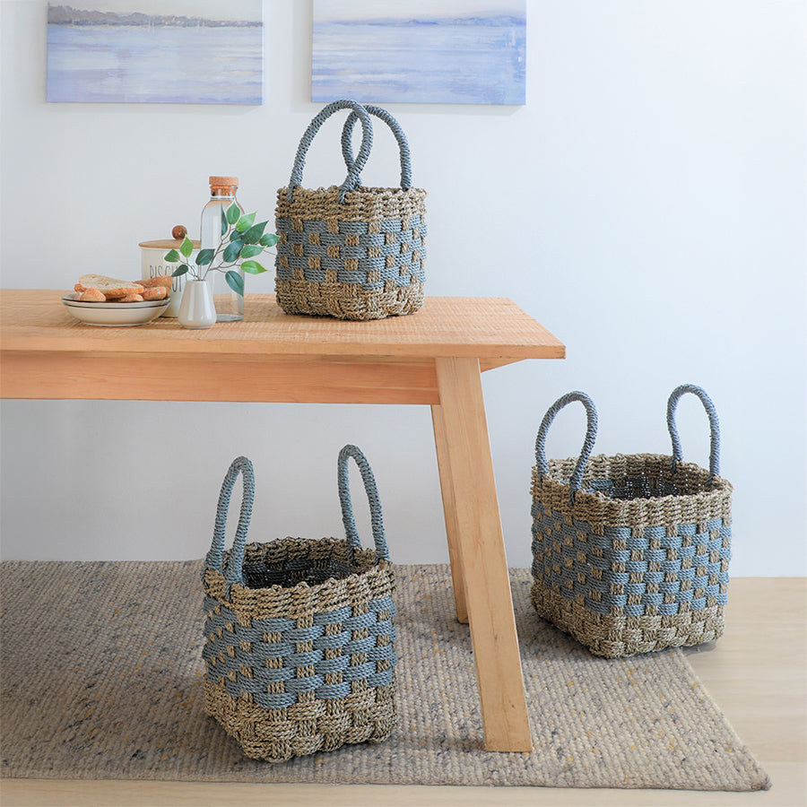 Woven seagrass basket set, Handcrafted storage baskets, Blue and beige rope baskets, Multipurpose woven baskets with handles, Natural fiber baskets for home organization, Decorative basket trio for living room, 
Sustainable woven basket set for home, Eco-friendly baskets for entryway or kitchen, Rustic rope basket set for modern interiors, Versatile square basket set with handles.