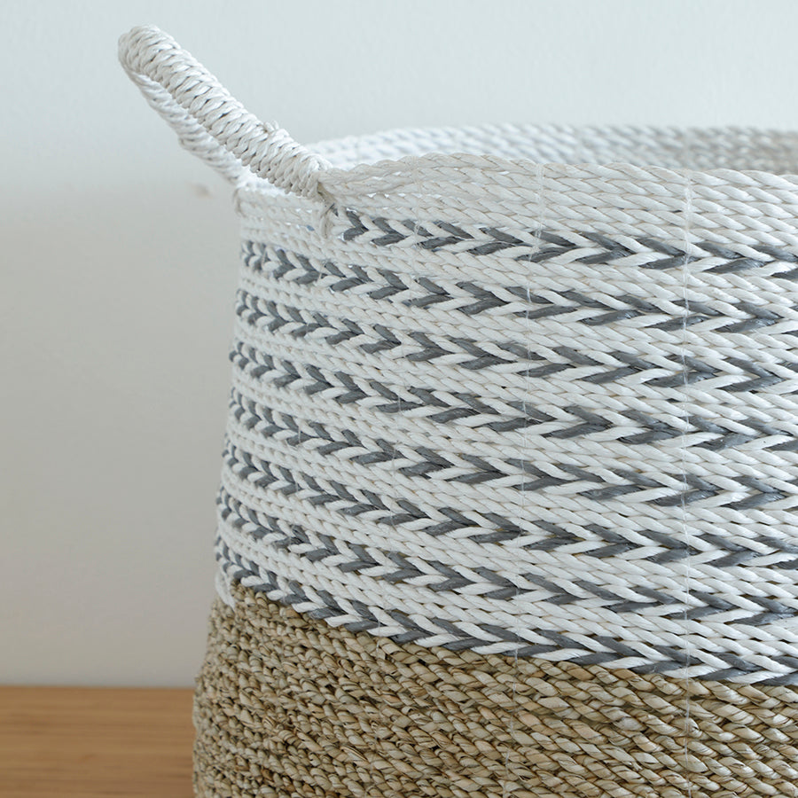 Close-up woven rope basket, Grey and white storage basket, Natural jute and rope basket, Decorative braided basket with handles, Handwoven textured storage bin, Two-tone woven home basket, Eco-friendly rope basket, Basket for shelf or corner storage, Artisan-crafted woven container, White grey jute basket detail, Premium quality woven basket .