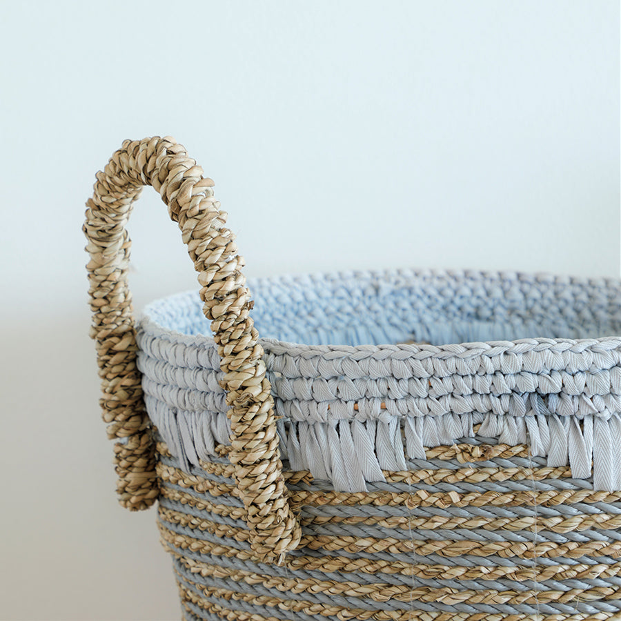 Woven basket with handles, Handwoven storage basket, Decorative jute basket, Seagrass storage basket, Natural rope basket, 
Boho chic storage basket, Round woven basket, Eco-friendly home storage, Two-tone jute and cotton basket, Handmade braided basket, 
Rustic woven basket, White fringe seagrass basket, Coastal decor basket, Natural fiber home basket, 
Textured rope basket.