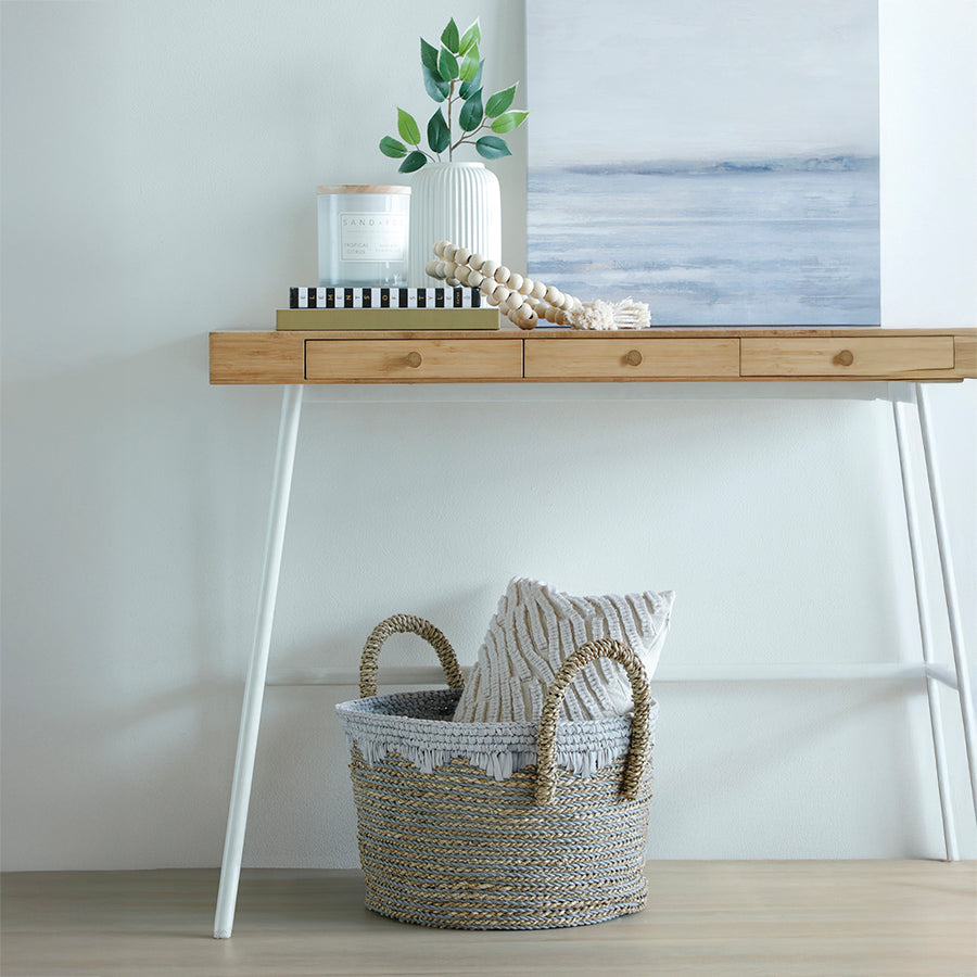 Woven basket with handles, Decorative jute storage basket, Handcrafted natural rope basket, 
Seagrass basket with white fringe, Round woven floor basket, 
Boho basket for living room storage, 
Neutral tone basket with cushion, 
Coastal style decorative basket, 
Handwoven storage basket with scalloped edge, Natural and white jute basket for home decor, 
Stylish woven basket for entryway or hallway, Modern boho basket for blanket or throw storage.