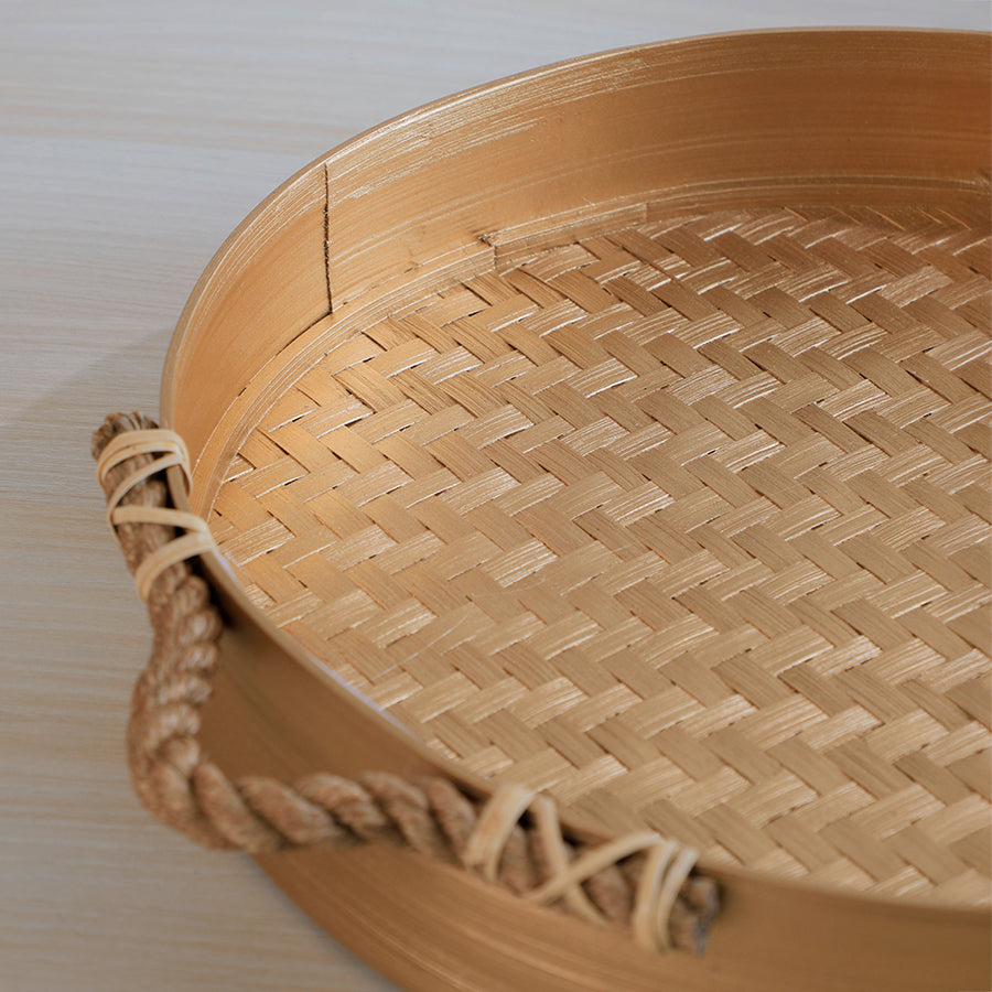 Woven bamboo tray, Round bamboo serving tray, Bamboo tray with rope handles, Natural woven tray, Handcrafted bamboo tray, Gold bamboo tray, Eco-friendly bamboo décor, Intricately woven bamboo base, Handwoven bamboo pattern,
Durable rope handle tray, Artisan-crafted bamboo tray, Sustainable handmade tray, Premium quality natural fiber tray, Rustic texture bamboo tray.