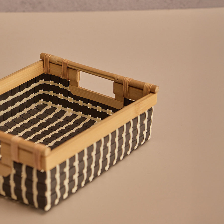 Small woven storage basket, Bamboo frame organizer basket ,Rectangular wicker basket with handles, Handwoven decorative storage box,
Eco-friendly bamboo storage bin,
Compact woven basket for shelf,
Black and white woven basket,
Rattan-style storage organizer,
Versatile home storage basket,
Natural woven basket with wood accents, Wicker style desk organizer bin, Bathroom or kitchen counter basket ,Sustainable home organization accessory, Modern woven bin with cutout handles,
Minimalist style utility basket.