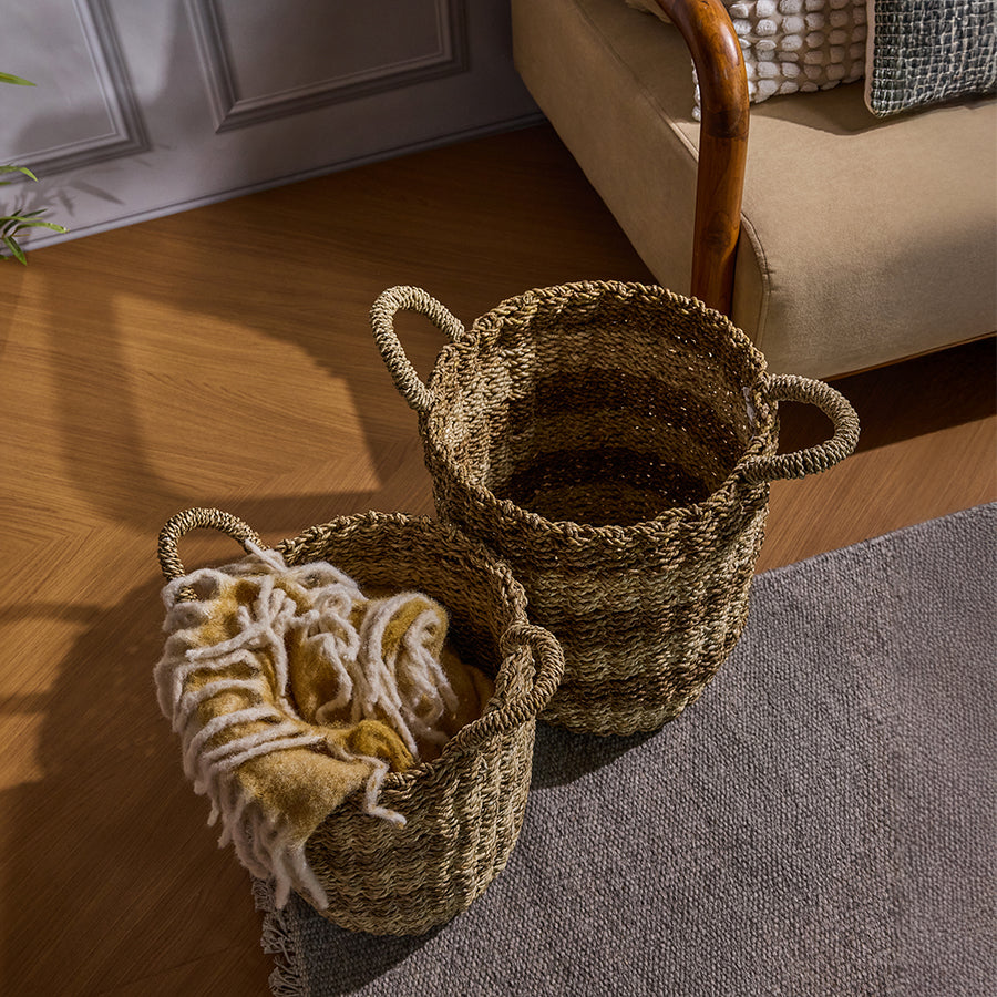 Handwoven seagrass baskets, Natural woven storage baskets,
Rustic storage baskets with handles,
Eco-friendly wicker baskets,
Jute and straw storage hampers,
Set of two natural seagrass baskets for home storage, Boho-style woven baskets for living room, Handmade basket with handles for blanket storage, Decorative floor storage baskets for cozy interiors, Artisanal woven baskets for home organization.