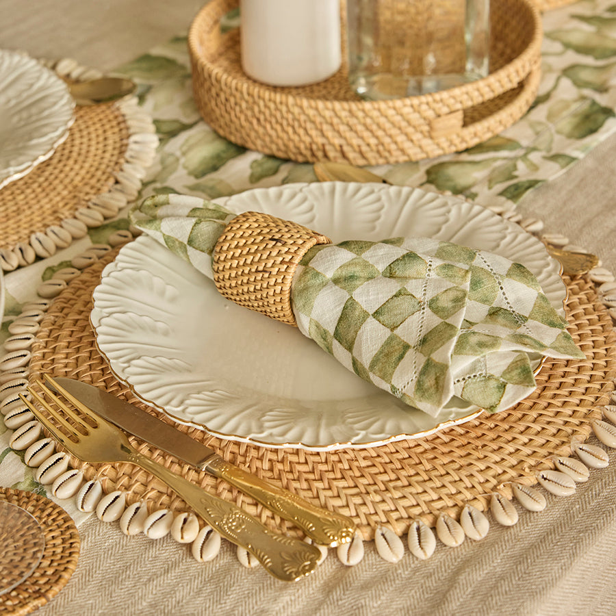natural rattan placemat, shell-trimmed placemat, Boho coastal placemat, woven table mat, beach house table décor, white ceramic dinner plate, embossed ceramic plate, leaf pattern dinnerware, elegant white plate , textured ceramic tableware, rattan napkin holder, woven napkin ring, Boho napkin accessory, eco-friendly napkin ring, rustic napkin décor.