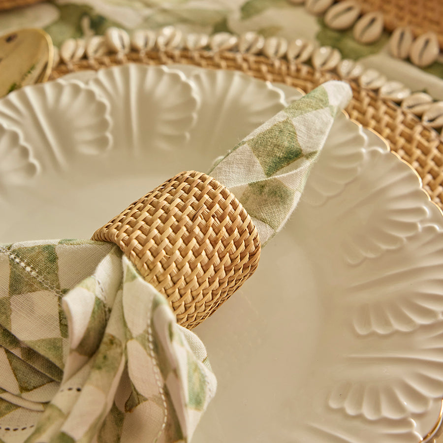 Green checkered cloth napkin, Watercolor gingham napkin, Soft cotton dinner napkin, Sustainable reusable table napkin, Green and white plaid napkin, Natural rattan napkin ring, Handwoven napkin holder, Eco-friendly wicker napkin ring, Boho style napkin ring, Rustic woven table décor, Scalloped ceramic dinner plate, White floral embossed plate, Handmade vintage-style tableware, Elegant ceramic dish .