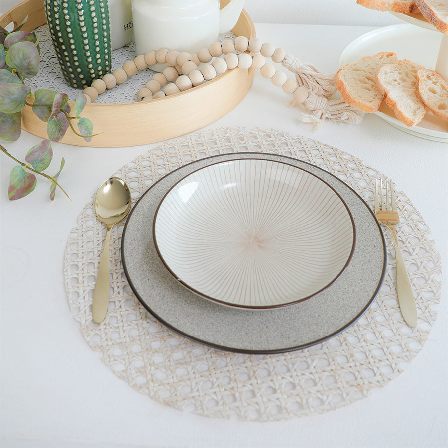 white rattan placemat, cane weave placemat, round woven table mat, whitewashed placemat, Boho chic placemat, farmhouse style table mat,
eco-friendly woven placemat, handmade cane placemat, ceramic dinnerware set, neutral ceramic bowl, stoneware dinner plate, artisan ceramic tableware, handmade ceramic dishes, rustic modern dishware, gold stainless steel cutlery,
matte gold flatware, luxury gold spoon and fork, designer gold utensils.