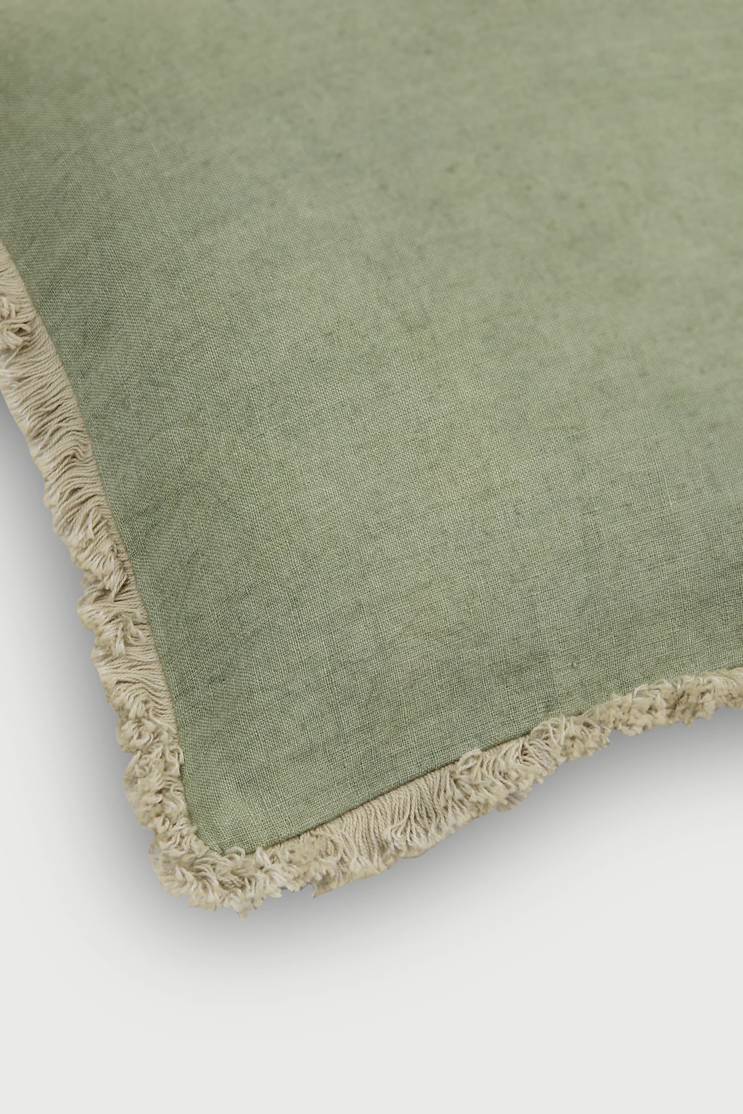 Green linen cushion , Fringe edge pillow, Decorative green throw pillow, Textured fringe cushion, Boho green cushion, Soft green accent pillow, Cotton-linen blend cushion, Neutral green pillow with fringe, Sage green cushion cover, Vintage-inspired green pillow .