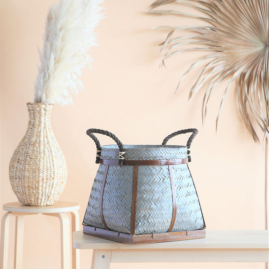 Grey woven storage basket, Handmade bamboo basket, Decorative rope handle basket,
Rustic home décor basket, Eco-friendly woven bin, Artisan handwoven basket, Square bottom woven basket, Multipurpose storage basket, Rope and bamboo basket,
Natural fiber decorative basket.