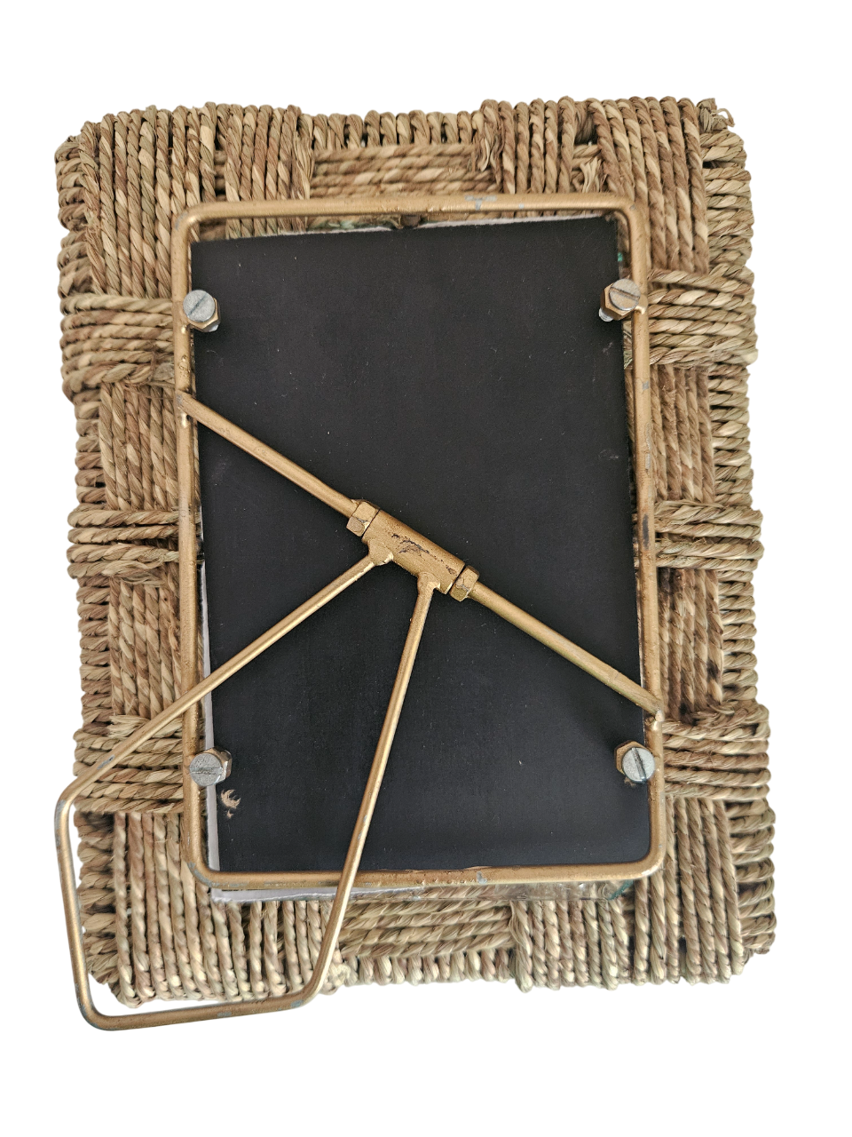 Woven rattan photo frame, Handcrafted jute photo frame, Rustic tabletop picture frame, Boho natural fiber frame, Eco-friendly handmade frame, Rope texture photo frame, 
Decorative rattan frame with metal stand, Wicker photo frame with brass support, Artisan picture frame for shelf décor, Sustainable woven photo frame. 