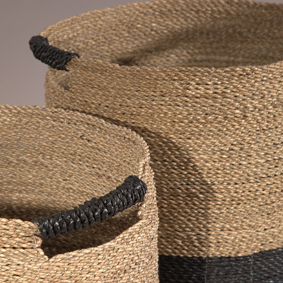 Handwoven natural basket, Seagrass storage basket, Eco-friendly seagrass basket, Durable natural fiber basket, Large woven basket for blankets or laundry, Stylish natural storage basket with black handles.

