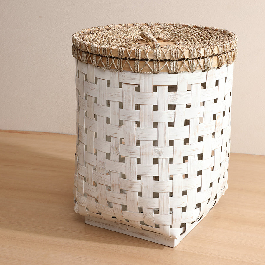white woven laundry basket, rustic storage basket with lid, natural woven hamper, farmhouse style laundry hamper, handwoven bamboo basket, eco-friendly storage solution, decorative white storage bin, 
lidded woven laundry basket.

