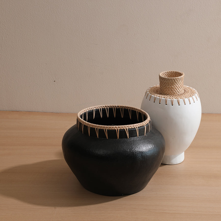 Black and white ceramic vases set, 
Decorative vases with woven rattan trim, Handcrafted ceramic vases duo, Matte black and white pottery vases, Artisan vases for shelf or tabletop, 
Minimalist woven accent vases.

Boho chic ceramic decor