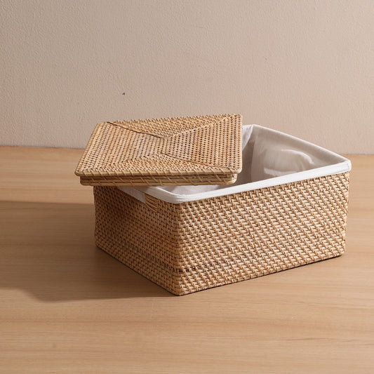 Woven storage basket with lid, Square wicker basket with cover, Rattan basket with fabric lining, Natural woven box organizer, 
Handwoven wicker storage bin, Decorative home storage basket, 
Eco-friendly rattan basket, Lidded basket for shelf or closet, Foldable storage basket with lid, Stylish organizing basket for living room. 

