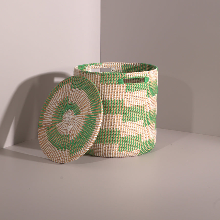 Natural fiber round basket, Eco-friendly storage container, Lidded woven hamper, Handmade basket with lid and handles, Artisan storage bin, Round woven basket with removable lid, Eco-friendly handwoven storage bin for home, Green and natural handwoven laundry basket. 