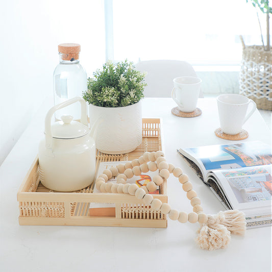 rattan serving tray, bamboo decorative tray, woven coffee tray, Boho rectangular tray, farmhouse style serving tray, rustic breakfast tray, eco-friendly bamboo tray, 
white ceramic kettle, enamel white kettle, farmhouse tea kettle, retro style kettle, vintage inspired teapot, 
artificial greenery plant, faux potted plant, decorative houseplant, tabletop faux plant, white ceramic planter. 