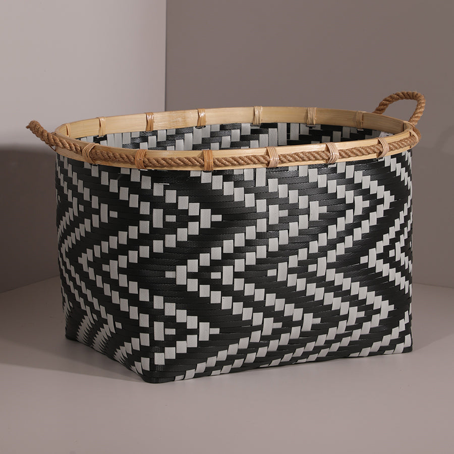 Large black and white woven basket, 
Handwoven zigzag storage basket, 
Black geometric pattern storage bin, Multi-purpose home storage basket, 
Woven bin for blankets, toys, or laundry, Rustic-modern storage bin, 
Eco-friendly basket with natural bamboo trim.