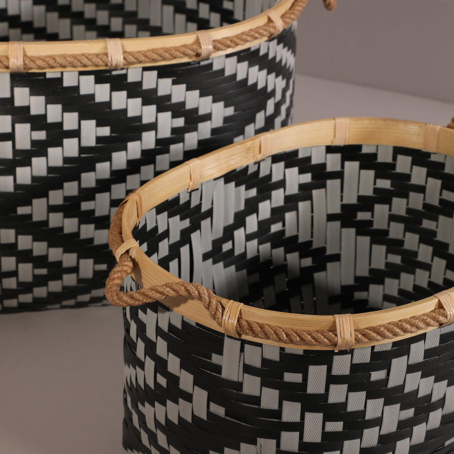 Black and white woven storage baskets, Handwoven baskets with bamboo rim, Toy storage baskets for nursery or playroom, Blanket and towel storage baskets, Bohemian-style black and natural baskets, 
Tribal pattern decorative bins.

