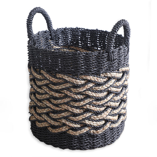 black and natural woven storage basket, handwoven basket with handles, large seagrass laundry hamper, braided rope basket for storage, eco-friendly decorative storage bin, modern Boho style woven basket, black jute and seagrass basket, handmade basket for blankets or toys, two-tone braided basket for home décor, rustic chic woven floor basket.
