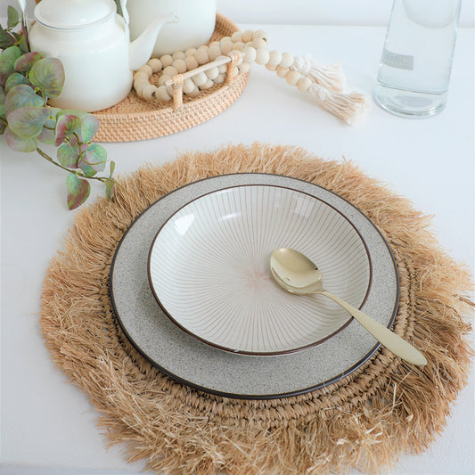 natural fringe placemat, woven straw placemat, Boho round placemat, 
seagrass table mat, rustic fringe charger, braided placemat, 
eco-friendly natural placemat, coastal style table mat, ceramic dinnerware set, artisan ceramic plate, 
stoneware dinner plate, handmade ceramic bowl, neutral tone dishware. 