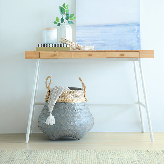 Grey woven planter basket, Decorative woven plant pot, Handcrafted seagrass planter Eco-friendly basket planter, 
Decorative indoor pot with handles, 
Handwoven grey basket planter. Minimalist home décor setup, 
Scandinavian style interior, Coastal décor ideas, Entryway décor inspiration, Serene interior design setup, Zen-inspired décor ideas, 
Calming home vignette