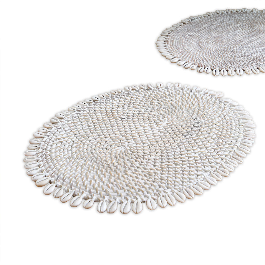 cowrie shell placemat, shell beaded placemat, coastal style table mat, 
oval woven placemat, Boho dining placemat, white shell table décor, 
handmade shell placemat, tropical table setting, beach house décor placemat, natural woven shell mat, coastal home accessories, 
ocean inspired tableware, handcrafted shell table mat, decorative dining placemat, 
summer coastal placemat. 