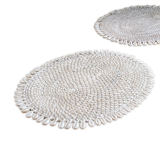 cowrie shell placemat, shell beaded placemat, coastal style table mat, 
oval woven placemat, Boho dining placemat, white shell table décor, 
handmade shell placemat, tropical table setting, beach house décor placemat, natural woven shell mat, coastal home accessories, 
ocean inspired tableware, handcrafted shell table mat, decorative dining placemat, 
summer coastal placemat. 