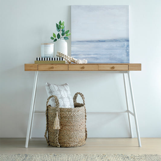 Handwoven seagrass basket, 
Decorative woven storage basket, 
Natural fiber basket with handles, Modern console table, Scandinavian entryway table, Minimalist wood and metal console, Neutral modern home accessories, Wooden bead garland décor, Modern coastal table styling .