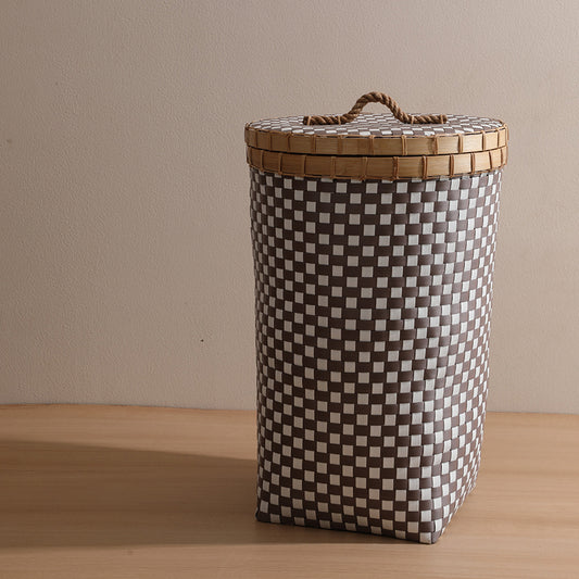 Tall woven laundry hamper, Checkered storage basket with lid, Plastic wicker laundry bin, Brown and white hamper basket, Lidded hamper for clothes storage, Vertical woven laundry basket with lid, Modern checkered hamper for bedroom, 
Plastic rattan-style laundry organizer. 

