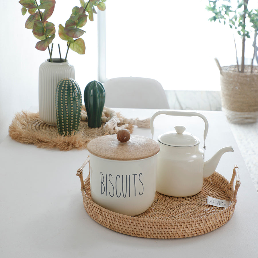 Rattan serving tray, Woven tray with handles, Natural rattan tray, Decorative rattan platter, Boho kitchen tray, Biscuit jar with wooden lid, Ceramic cookie jar, Farmhouse biscuit container, Kitchen storage canister, White ceramic teapot, 
Vintage enamel teapot, Minimalist teapot with handle.