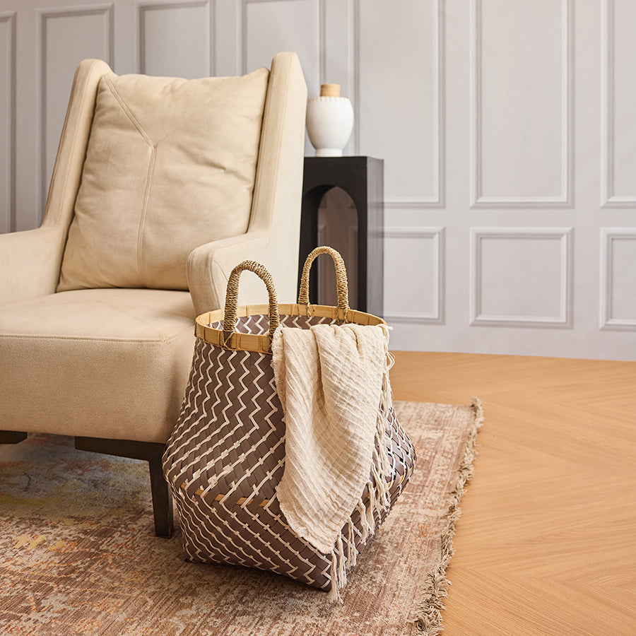 Cozy living room décor, Modern home accents, Stylish home organization, Zigzag patterned storage basket, Woven decorative bin, Stylish indoor basket, Cream throw blanket, Soft textured blanket, 
Lightweight woven throw, Decorative couch throw.

