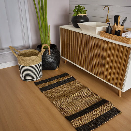 Handwoven striped basket, Black and natural storage basket, Seagrass laundry basket with handles, Eco-friendly woven storage bin, Handwoven jute runner rug, Brown and black striped hallway runner, Mid-century modern bathroom vanity, Wooden bathroom cabinet with sink, Slatted wood sink cabinet, Woven bathroom accessory set, 
Natural bathroom organizer tray, 
Eco-friendly soap dispenser set .

