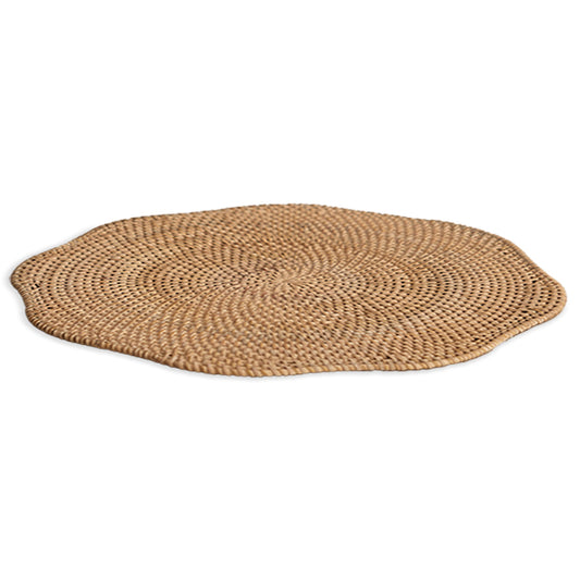 wavy edge rattan placemat, woven rattan charger plate, natural fiber placemat, rustic woven table mat, 
Boho style placemat, handmade rattan placemat, organic table setting, coastal dining placemat, eco-friendly woven mat, artisanal rattan tableware, round wicker placemat, 
neutral dining décor, 
sustainable table accessory. 