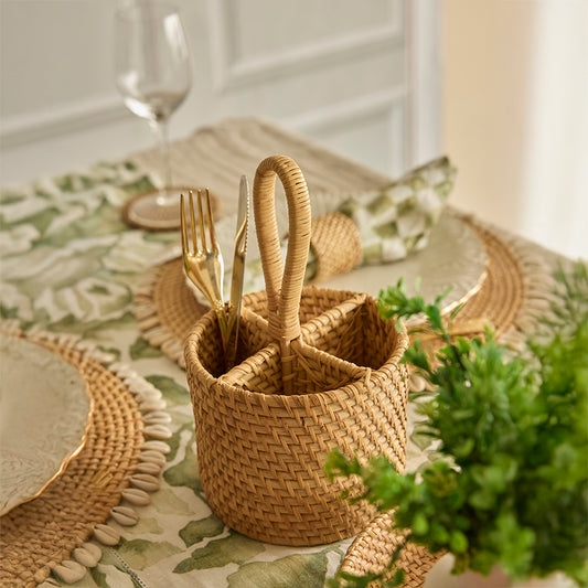 Round rattan cutlery holder, Woven utensil caddy with compartments, Handcrafted flatware organizer basket, Rustic dining table caddy, Boho kitchen utensil holder, Picnic cutlery basket with handle, Bamboo-style woven caddy, Natural woven dining table organizer, Decorative table flatware holder. 


