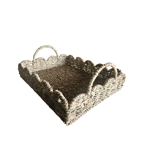 Woven square serving tray, Scalloped edge wicker tray, Natural rattan tray with handles, Handwoven decorative basket tray, Seagrass tray for home décor, Eco-friendly square woven tray, Rustic tabletop serving tray, Boho-style handwoven storage tray, Water hyacinth scallop tray, Decorative tray with natural finish. 

