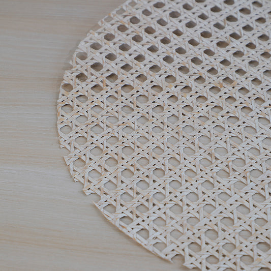 woven placemat, rattan placemat, cane placemat, round woven table mat, natural fiber placemat, handmade table mat, Boho chic placemat, rustic woven placemat, farmhouse table mat, white cane placemat, whitewashed rattan placemat, ivory woven placemat, neutral tone placemat, off-white woven mat. 