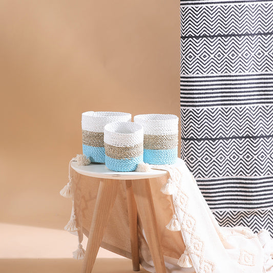 Aqua mini woven baskets, Color block rope baskets, Small round storage baskets, Handwoven decorative baskets, Coastal style home décor baskets, Aqua and white rope baskets for storage, Handcrafted mini organizer baskets, Decorative baskets for table or shelf, Natural fiber baskets with tassel accents. 