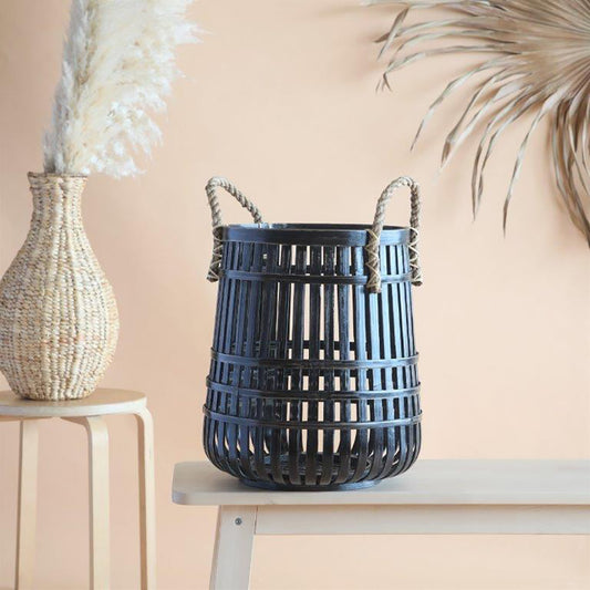 Black bamboo basket, Decorative storage basket, Open weave bamboo basket, Rope handle storage bin, Tall bamboo hamper, Rustic home décor basket, Modern Boho laundry basket, Woven black bamboo bin, Multipurpose storage basket, Eco-friendly decorative basket, Black open weave bamboo basket with rope handles, Decorative bamboo storage bin for modern interiors, 
Handcrafted bamboo laundry basket for home organization .
