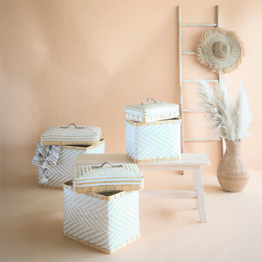 White bamboo storage baskets, Woven trunk baskets with lids, Handwoven laundry hampers, White and beige chevron baskets, Eco-friendly bamboo storage boxes, Sustainable woven home organizers, 
Decorative Boho storage bins, 
Artisan lidded baskets for storage, 
Minimalist woven baskets with handles, Multipurpose natural fiber hampers. 

